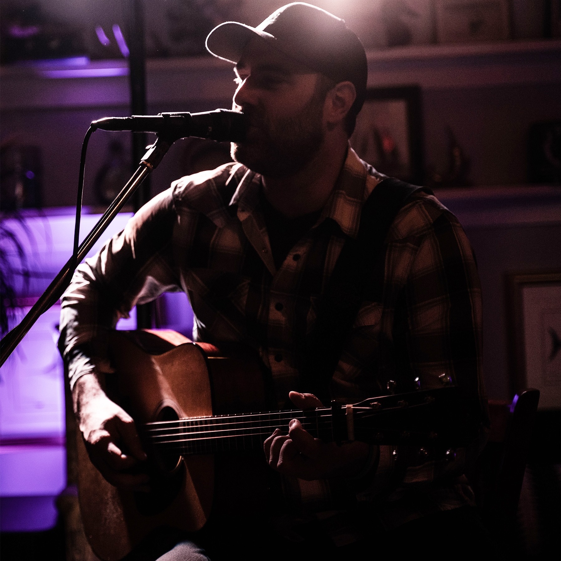 Kevin Brinson playing guitar and singing