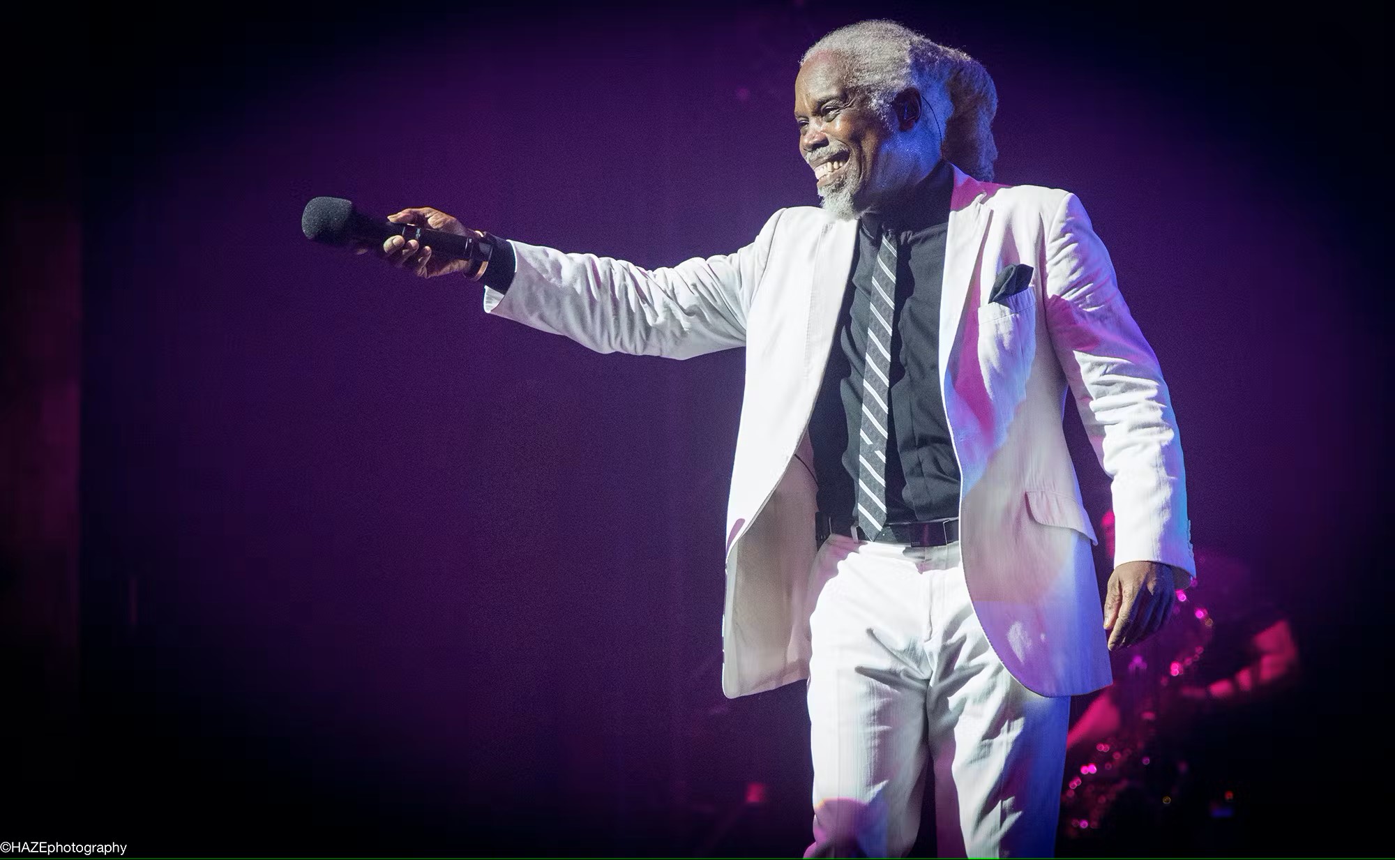 Billy Ocean on stage in white suit