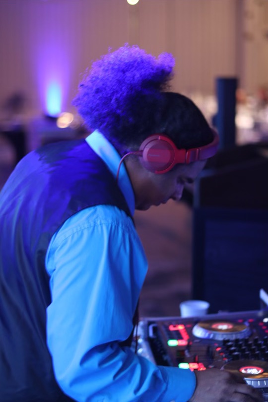 DJ with headphones and vest