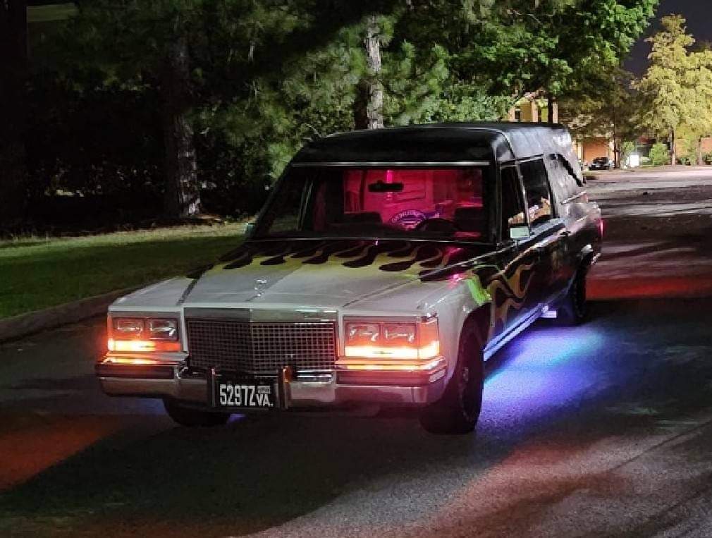 Painted and lit hearse