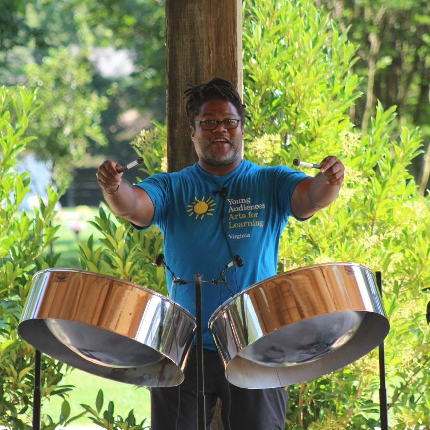 man playing steel drums